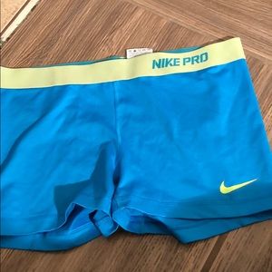 NIKE PRO DRI FIT BLUE AND YELLOW WORKOUT SHORTS